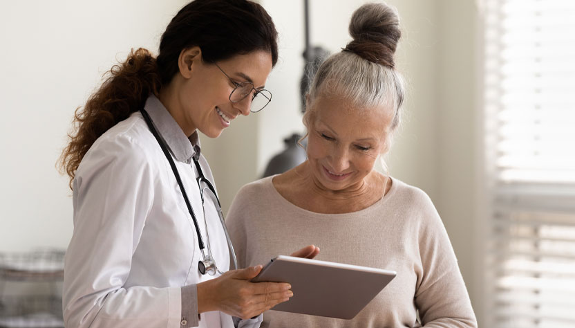 a doctor showing a woman a chart
