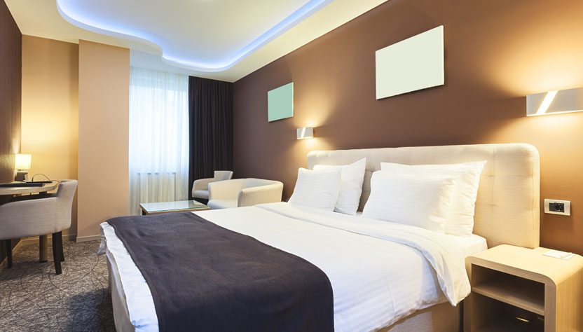 a comfortable looking bed in a hotel room